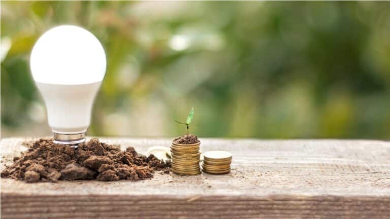 led bulb and coin stack saving concept electric 2023 11 27 05 13 33 utc