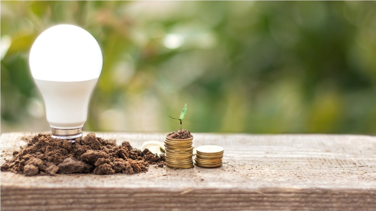 led bulb and coin stack saving concept electric 2023 11 27 05 13 33 utc