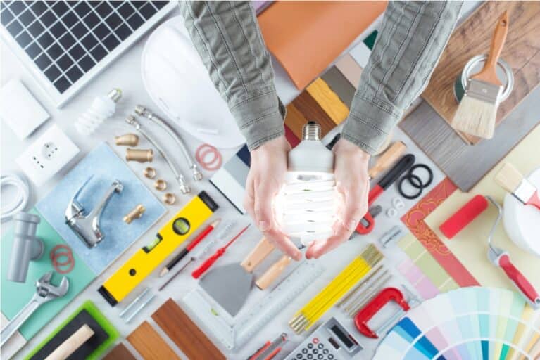 man holding a cfl energy saving lamp